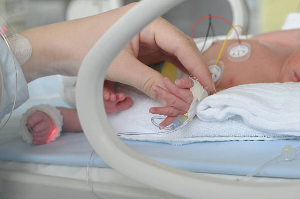 istock Newborn Premature Infant with Mother's Hand 160267805