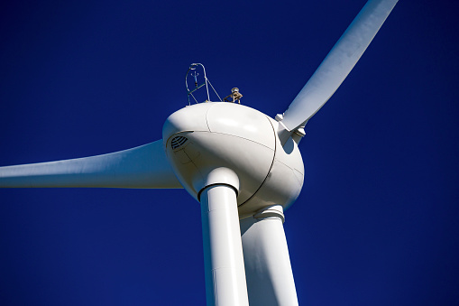 Close-up wind turbines stock photo.