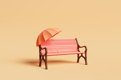 3d rendering of opened orange umbrella with handle placed on empty red wooden bench surface against beige background in daylight during autumn vacation