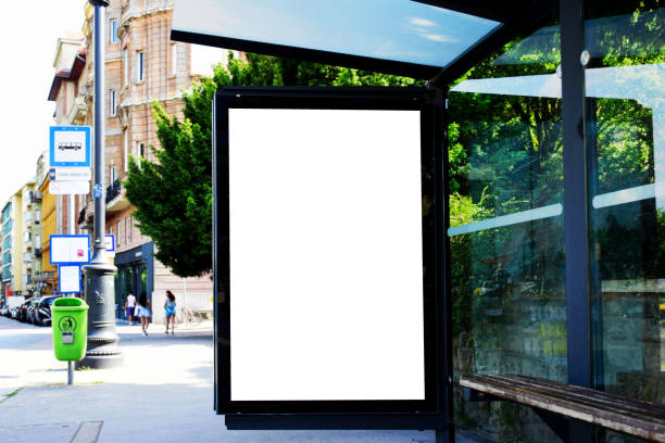 istock bus shelter with lightbox. blank white billboard ad panel at bus stop. mockup template 1602695130