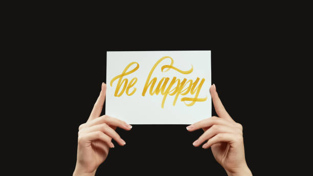 istock Be happy motivation slogan hands encouraging text 1602700034