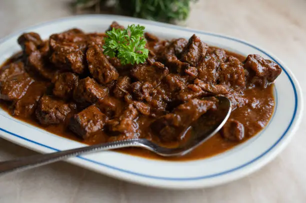 Traditonal german beef goulash. Served ready to eat on a serving platter with spoon.