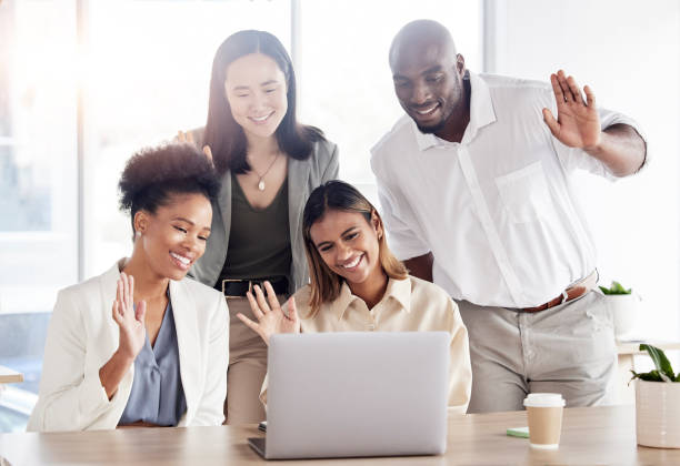 istock Business people, group and wave on video call with laptop for communication, hello or diversity in team. Black man, women and computer for webinar, online workshop or greeting with smile for kindness 1602723480