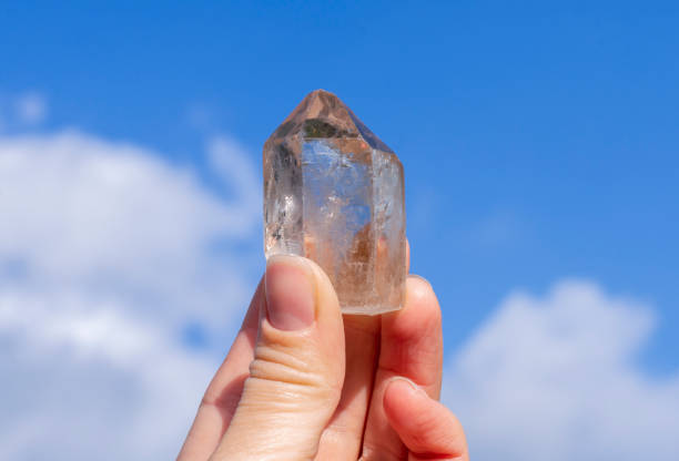 istock Natural rock crystal mineral in hand 1602763558
