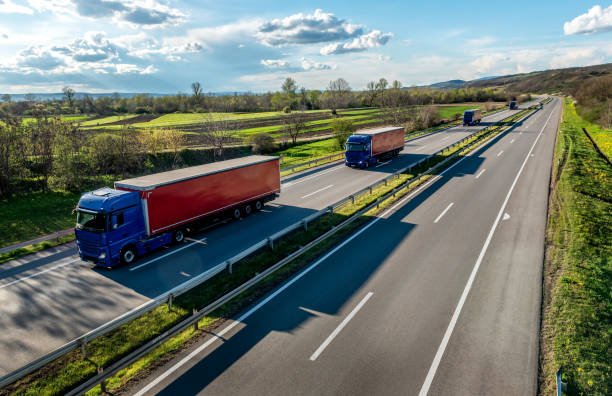istock Convoy of transportation trucks 1602779566