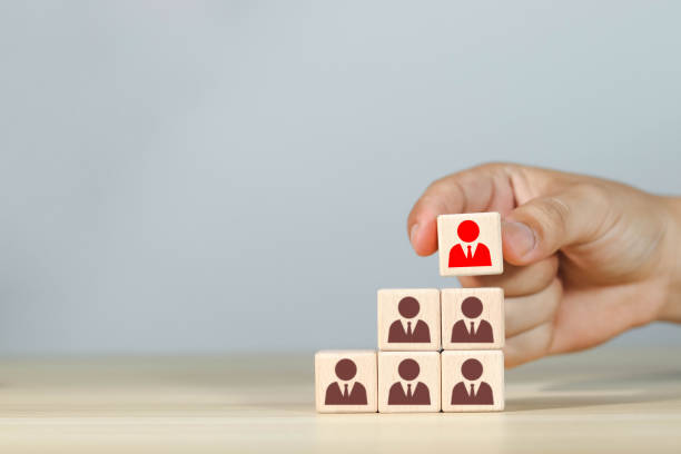istock The leader is left on a wooden cube. 1602791757