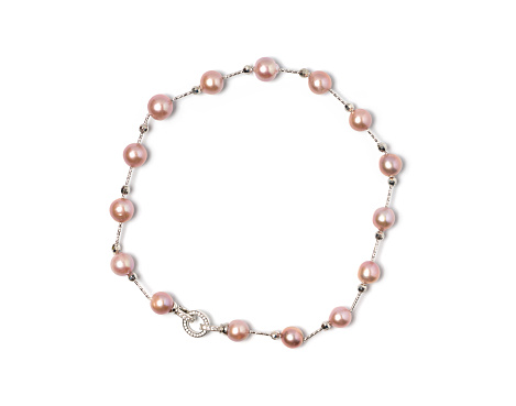 A meticulously crafted necklace, presenting multiple lustrous pink pearls threaded together. Enhanced by a finely detailed sterling silver clasp, the elegance is undeniable.