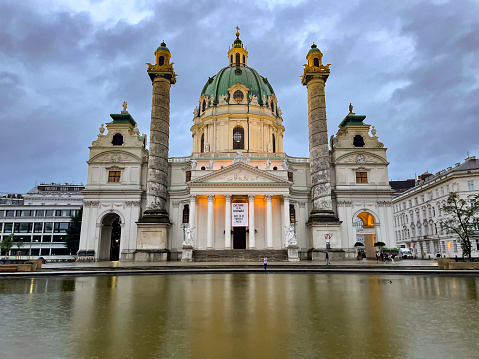 Karlskirche baroque church during an overcast evening in Vienna, Austria.