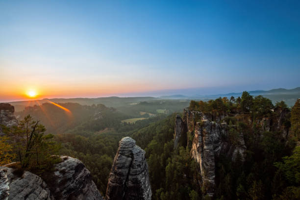 istock the sun rises at the elbsandsteingebirge 1602831578