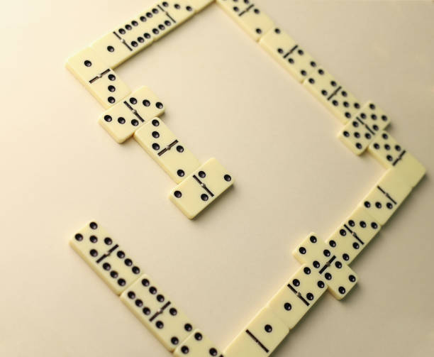 istock dominoes with black dots 1602858361