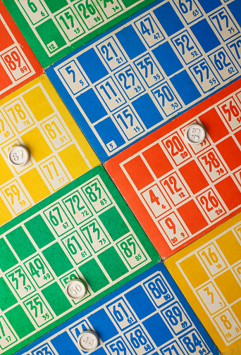 logical fun family and friendly board game loto bingo and bright multi-colored cards with numbers in the photo