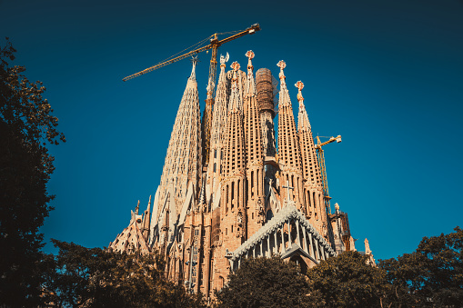 Barcelona, Spain - 2 Aug 2023: Sagrada Familia basilica in Barcelona, Spain. The Antoni Gaudi masterpiece has become a UNESCO World Heritage Site in 1984.