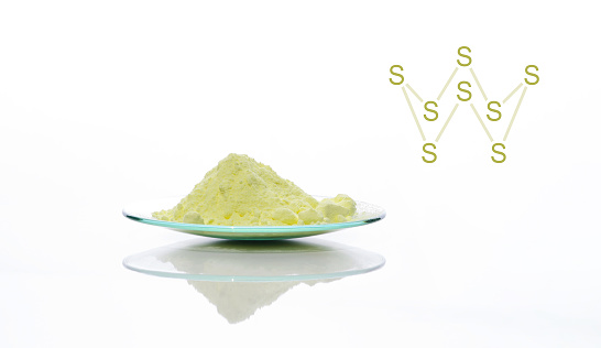 Sulfur Powder in Chemical Watch Glass with molecular structure.