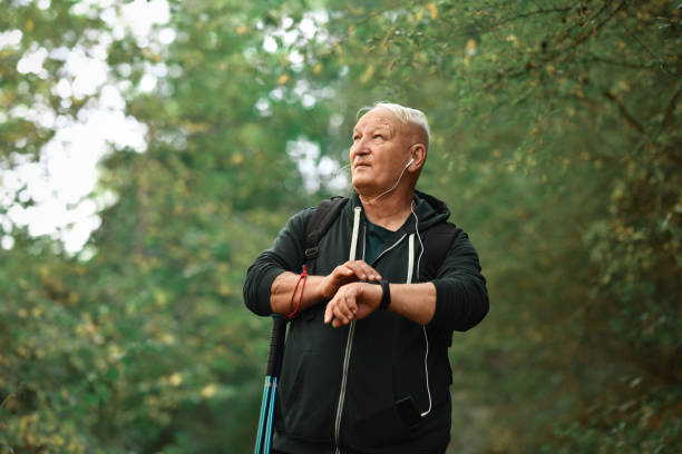 istock Senior Hiker Using Smartwatch For Communication In Forest 1602895225