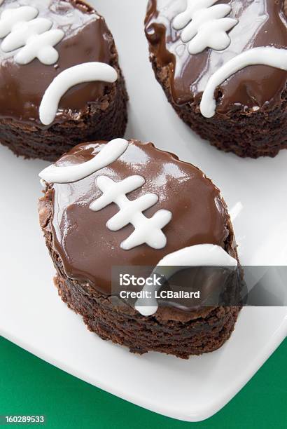 Three Football Shaped Double Fudge Chocolate Brownies On White Plate Stock Photo - Download Image Now