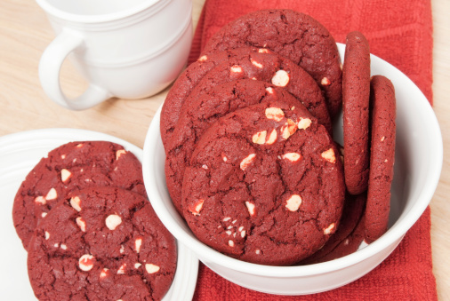 red velvet christmas cookies served with milk and red napkin