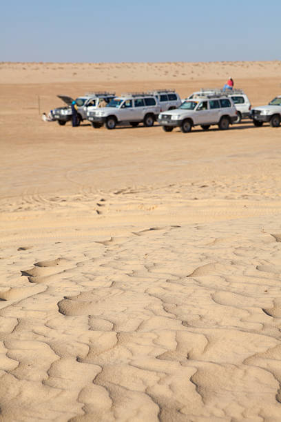 istock Off-road vehicles at rest in Sahara desert 160291950