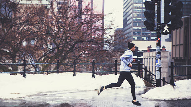 A man running in the winter snow