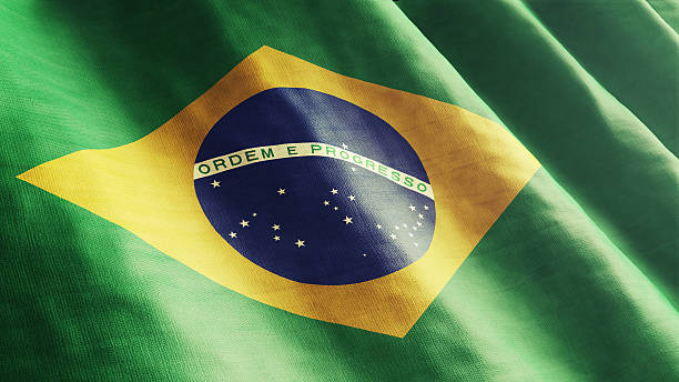 Bazilian Flag High resolution Brazilian Flag flowing with texture fabric detail. brazil stock pictures, royalty-free photos & images