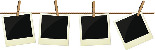 Four polaroid pictures hanging on rope A large jpeg is included drying photos stock illustrations