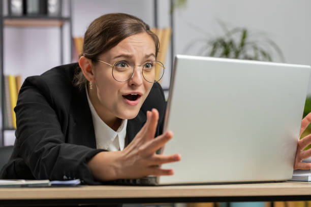 istock Irritated tired businesswoman working on laptop website problem, computer virus data loss by hacking 1602961750