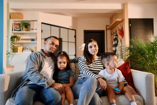 istock Beautiful family sitting at home 1602973307