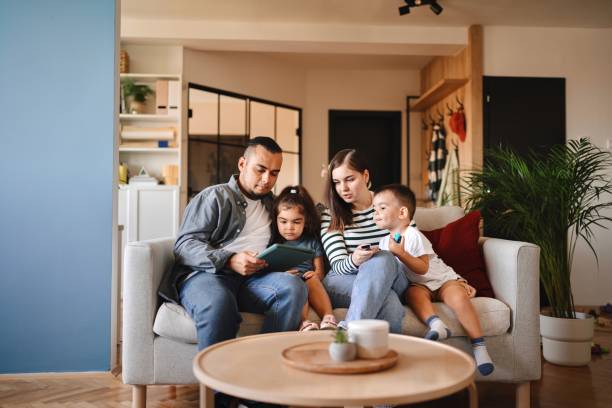 istock Modern family relaxing at home 1602973308