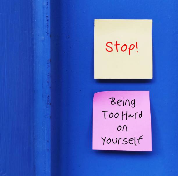 istock Two notes with handwritten text STOP! BEING SO HARD ON YOURSELF - overcome own worst critics, negative criticism  to our flaws and mistakes by developing approach of self-compassion and kindness 1602986560