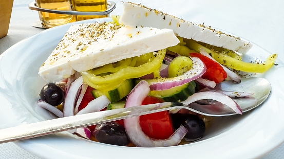 Original Greek salad close-up in tavern.