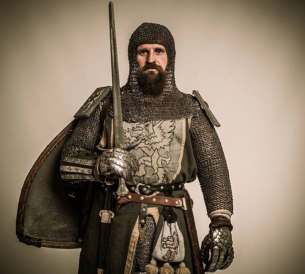 Medieval knight with sword and shield stock photo