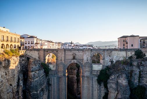view of Ronda early in the morning. Puente nuevo bridge and cliff in the front. Ronda is a town in the Spanish province of Málaga.