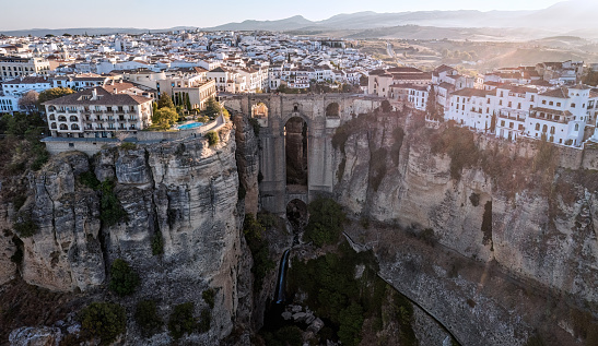 Aerial panoramic view of Ronda early in the morning. Puente nuevo bridge and cliff in the front. Ronda is a town in the Spanish province of Málaga.