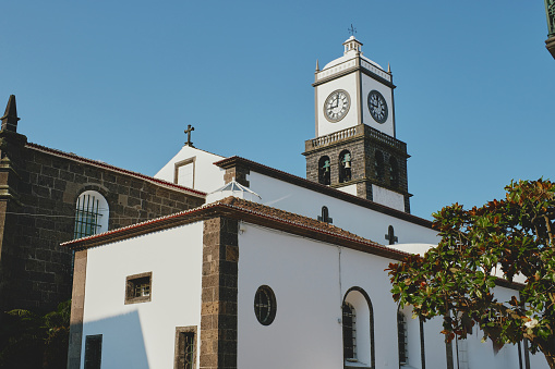 The Main Square of Ponta Delgada. Ancient architecture view with bell tower exterior at morning against blue sky. Sao Miguel island Azores, Portugal. Travel destinations and famous places concept