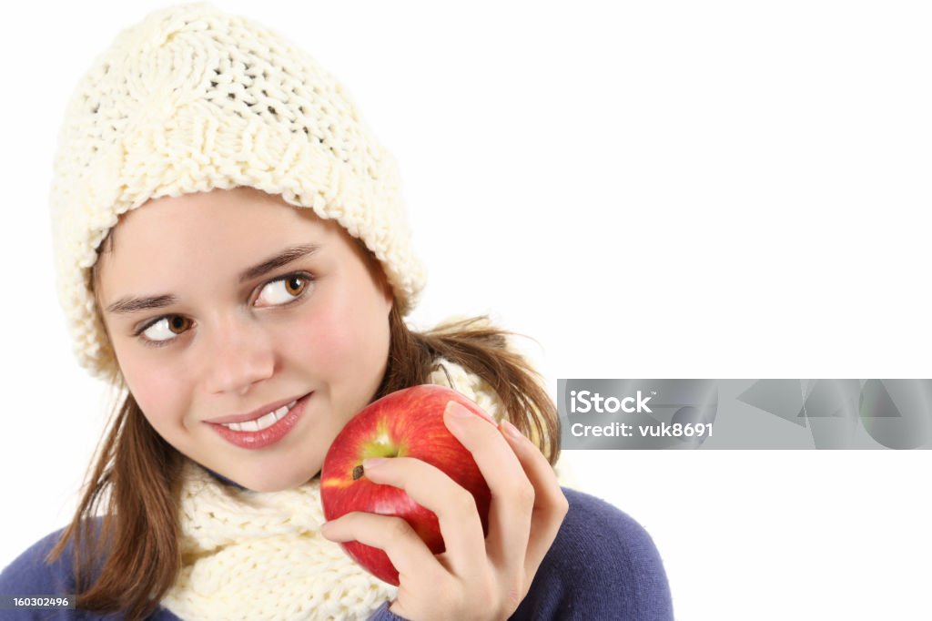 Jolie adolescente tenant la pomme rouge - Photo de 14-15 ans libre de droits