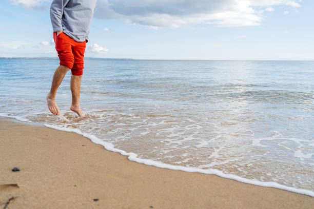 istock Young Man Jogging On The Beach In Greece 1603031897