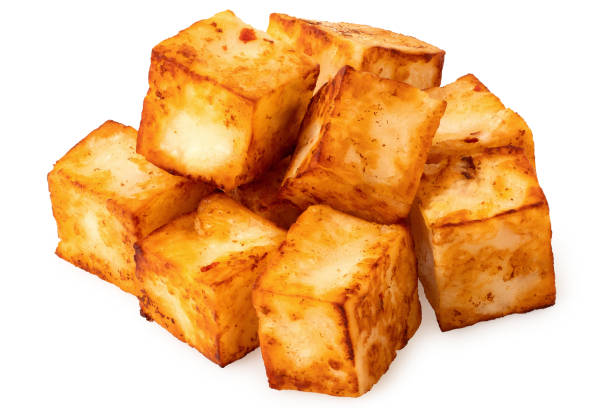 istock Fried cubes of halloumi cheese with red chilli isolated on white. 1603048199