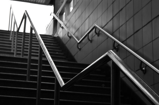 Railings and stairs in modern city in black and white.