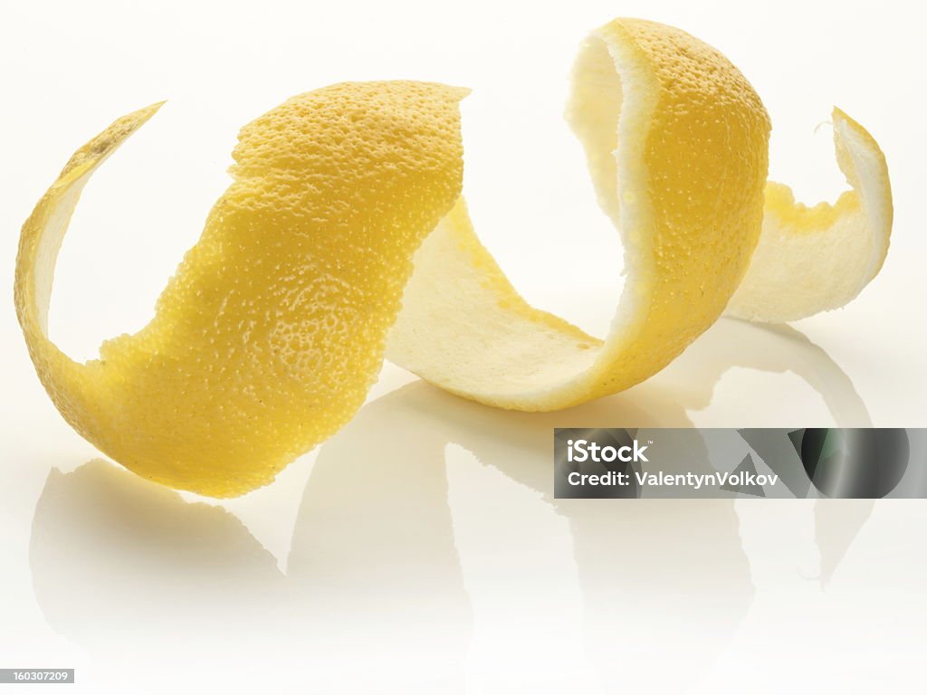 Twist of citrus. Twist of citrus peel on a white background. Zest Stock Photo