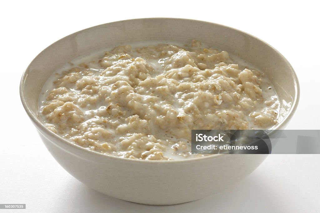 Bowl of oats porridge with milk Oatmeal Stock Photo