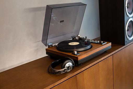 Home Stereo Turntable System Placed on Retro Self with Space for Text. Includes Vintage Vinyl Record Player, Headphones and Speakers.
