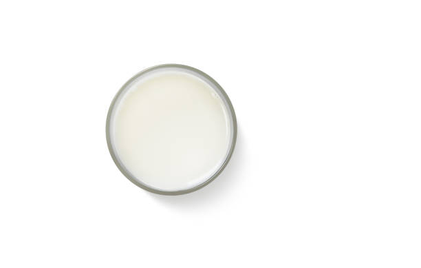 istock milk in glass, top view, isolated on white background 1603091459