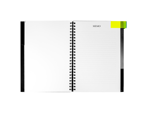 Opened spiral notebook with yellow page marker note isolated on white. Blank pages for copy space. Reminder concept