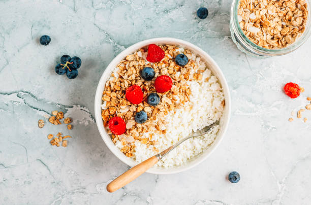 istock Cottage cheese breakfast bowl with granola, blueberry and raspberry. 1603101530