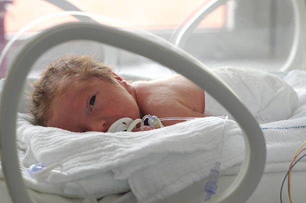 istock Newborn baby in incubator with a pacifier  160310363