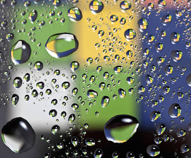 Water droplets on glass stock photo