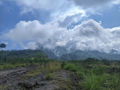 Trekking path with mountain view and cloudscapes in the sky