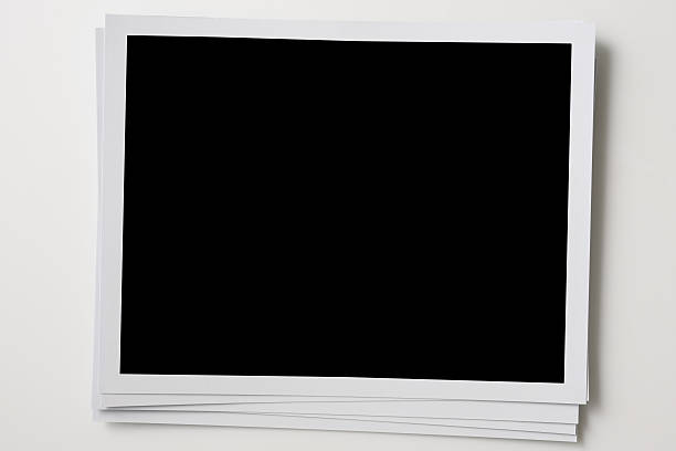 istock Isolated shot of stacked blank photo frames on white background 160312290