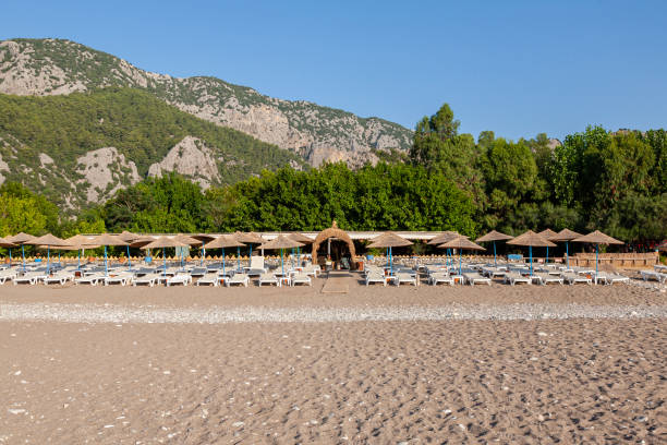 istock Empty sun loungers and sunrise. 1603124932