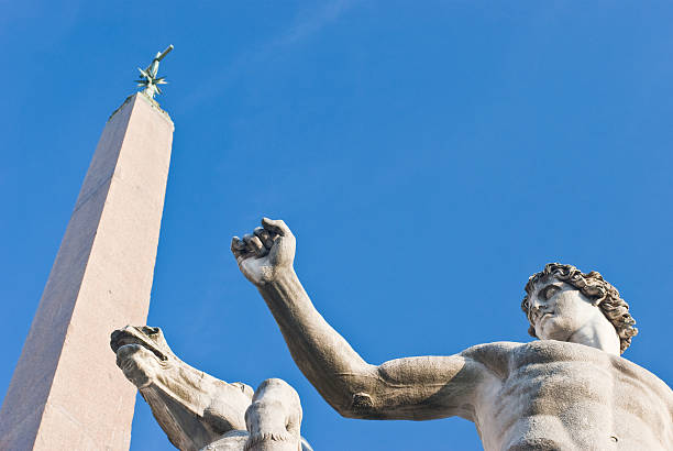 About Rome: Dioscuri Fountain Obelisk, Piazza Quirinale, Italy Rome, Italy - A detail of one of the Dioscuri statues and the Obelisk of Augusto at the Dioscuri Fountain in Piazza del Quirinale, Rome, Italy. Architect: Domenico Fontana. quirinal palace stock pictures, royalty-free photos & images