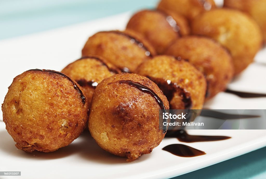 cheesecakes closeup Roasted cheese balls deep fried poured chocolate Appetizer Stock Photo